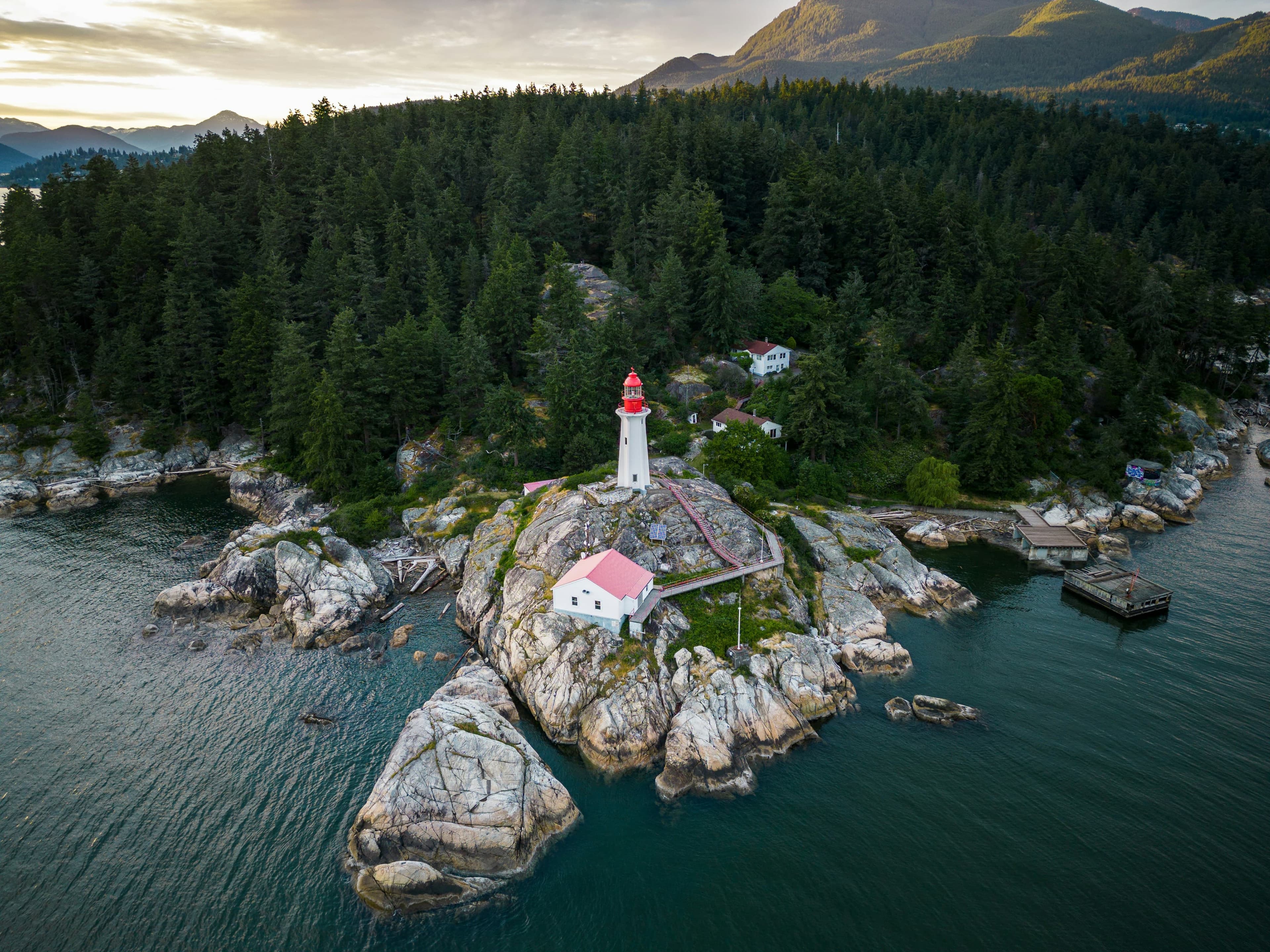 Aerial view of a lighthouse on a rocky island, Lighthouse Park, West Vancouver, BC